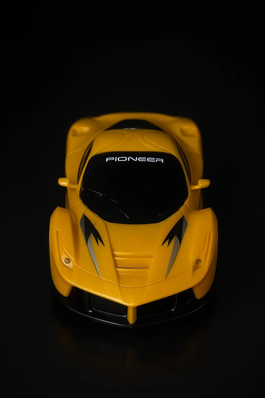 Top-down front view highlighting black windshield, hood vents and sharp silver stripe accents