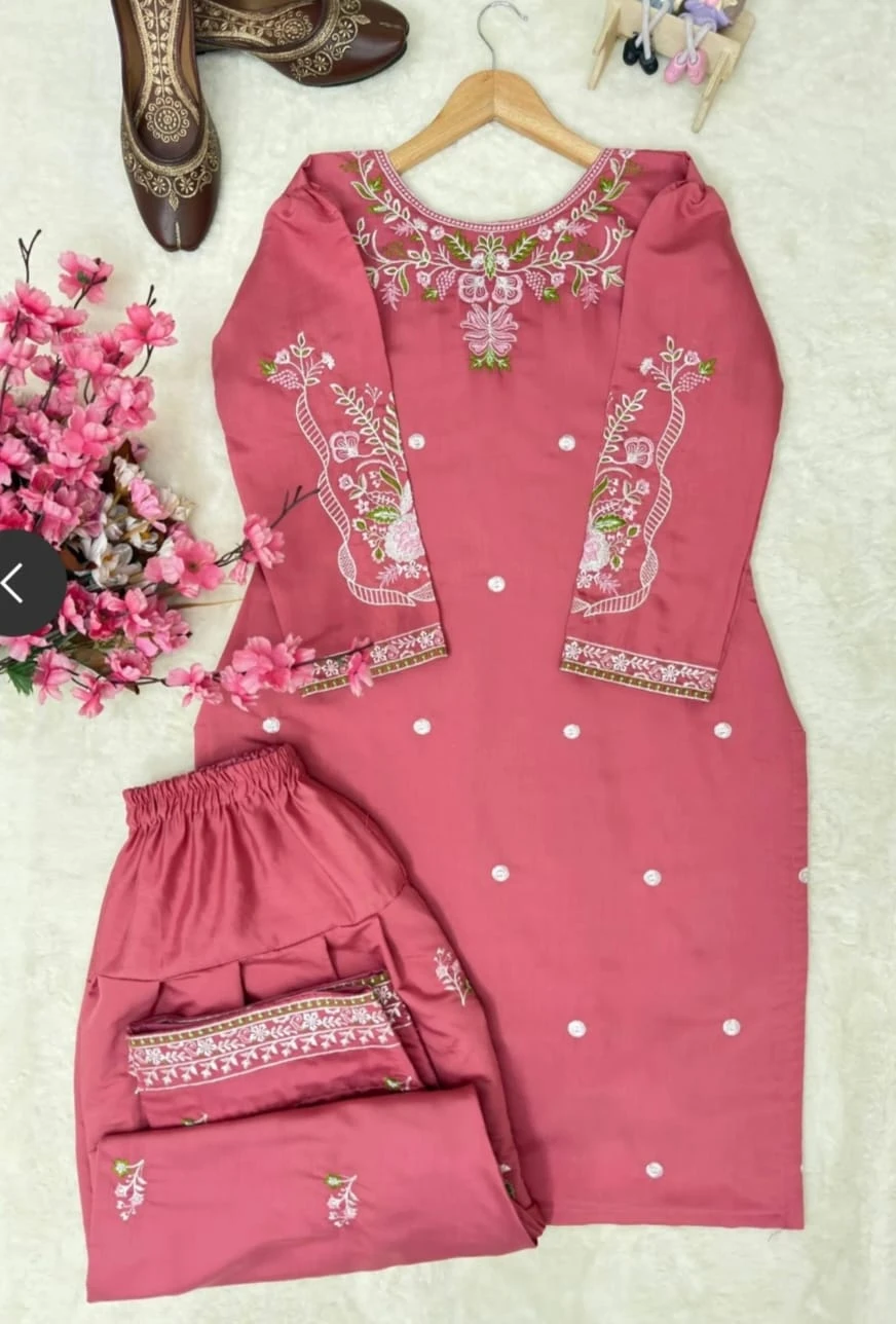 Flat lay of pink embroidered kurta/top with matching palazzo-style bottom