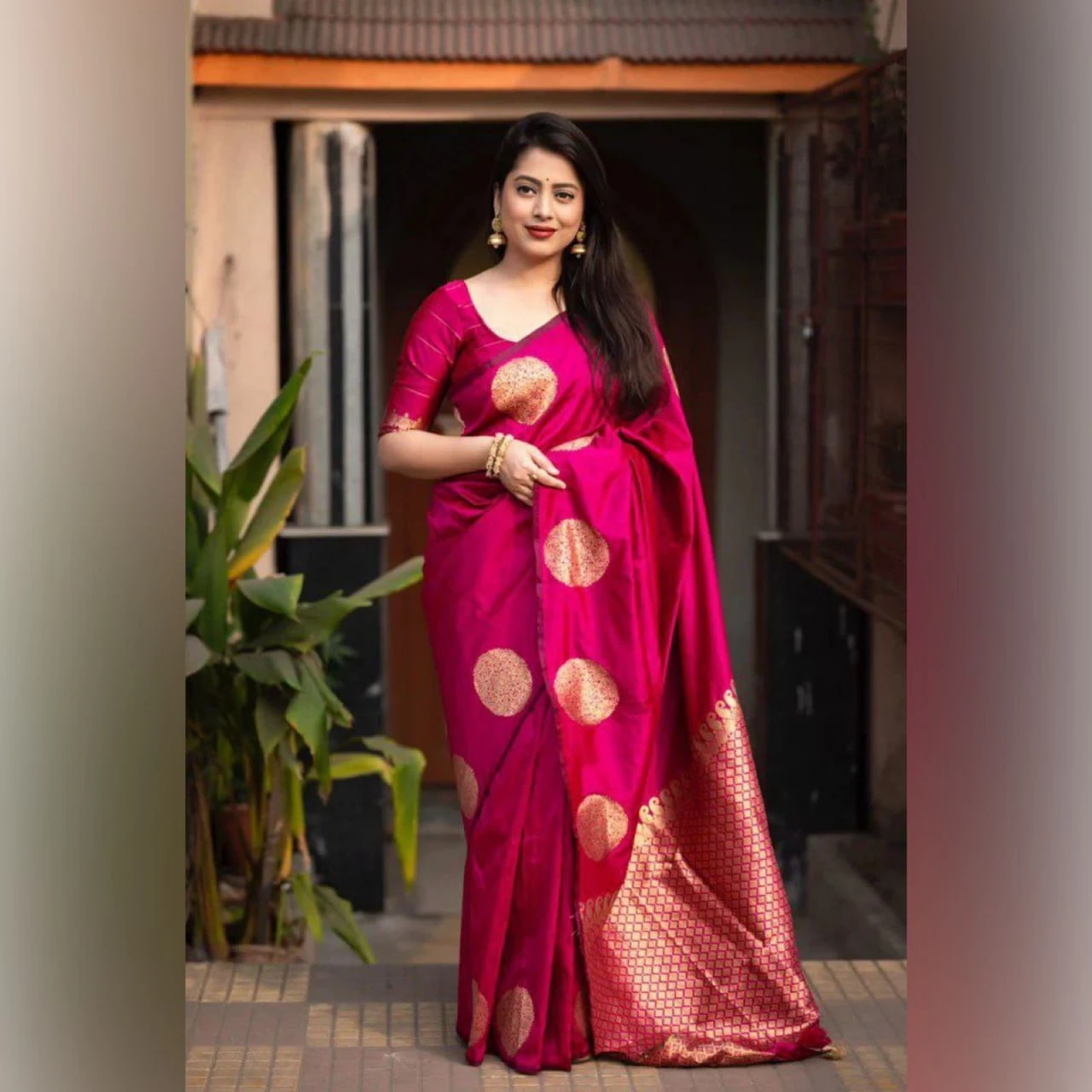Fuchsia pink soft silk saree with gold circular motifs and woven pallu panel
