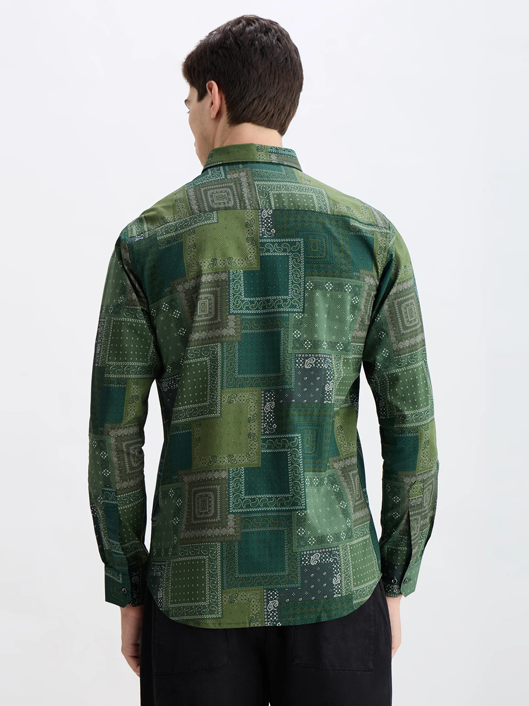 Back view of the green long-sleeve shirt with full all-over patchwork print