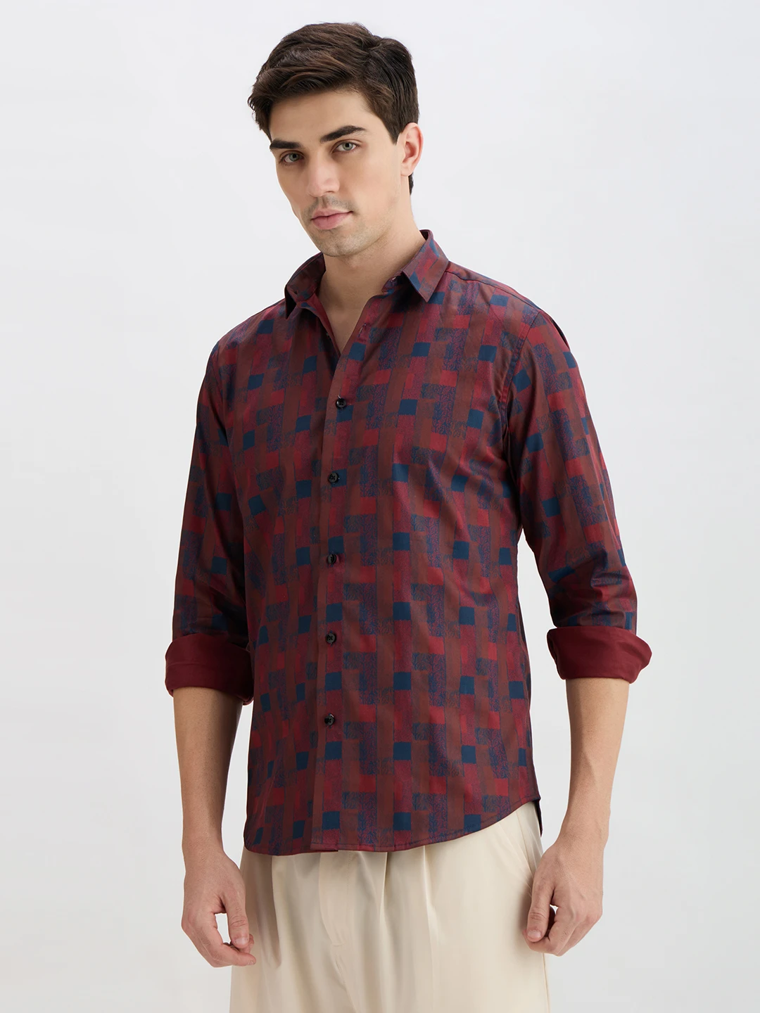 Front view of maroon geometric print shirt with rolled cuffs and spread collar