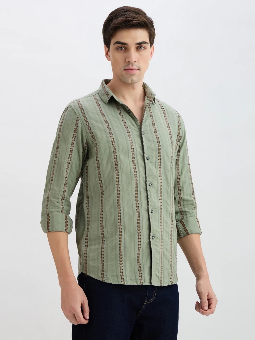 Angled front-right view of the collared shirt with button placket and rolled cuffs