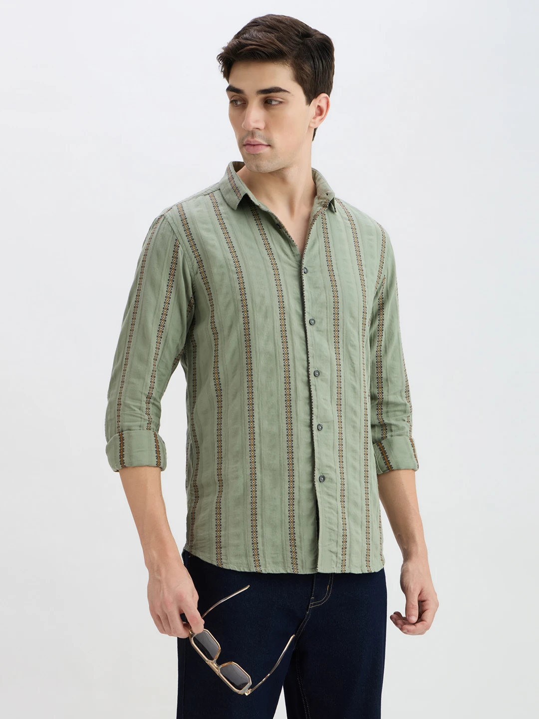 Three-quarter front view with rolled sleeves, side profile, and sunglasses in hand