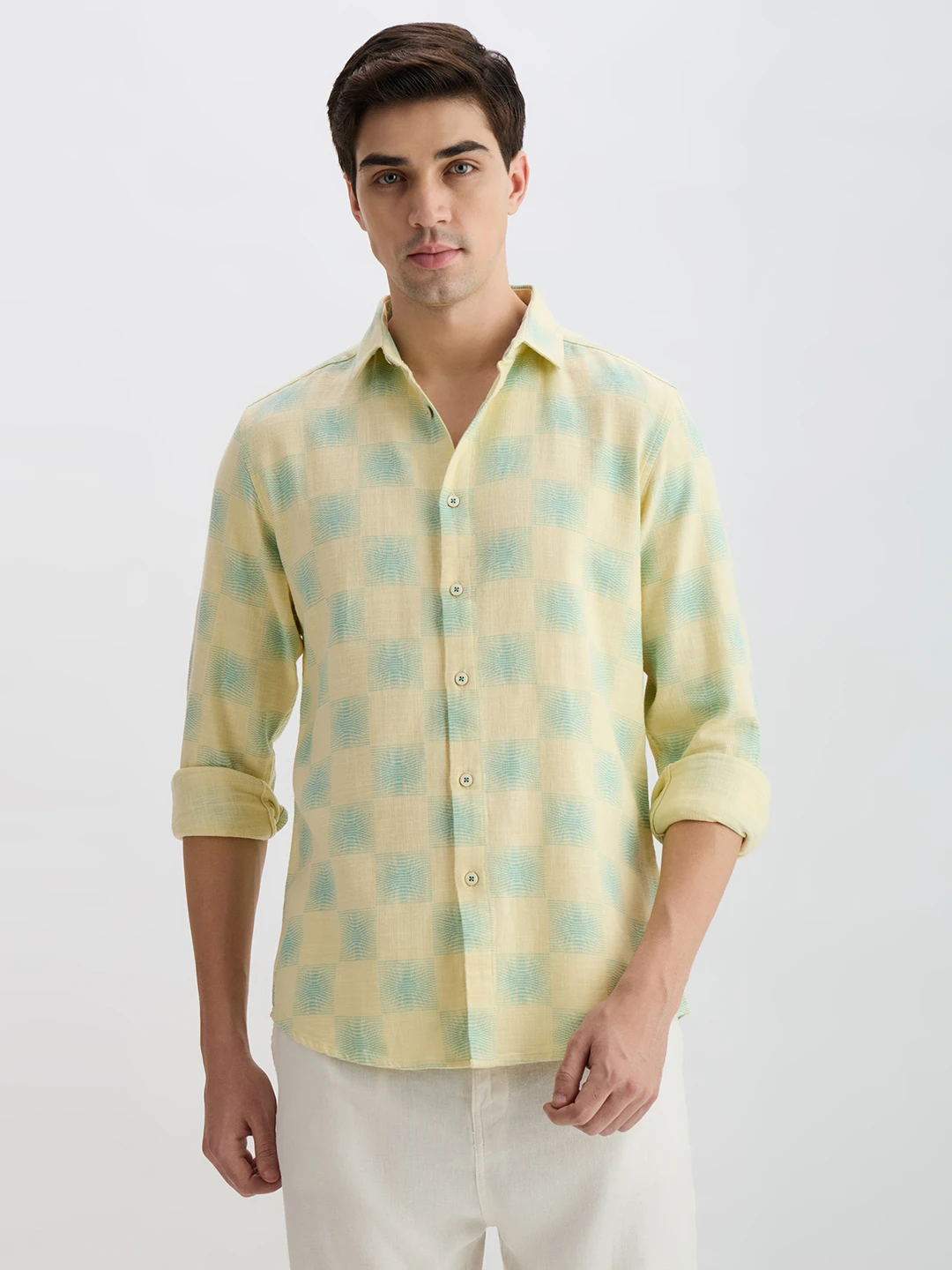 Front view of yellow and mint checked casual shirt with rolled sleeves on model