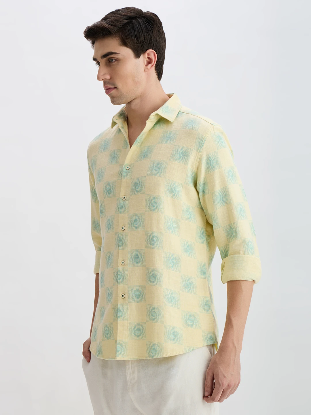 Left-side angle showing the shirt's checked pattern, collar and curved hem