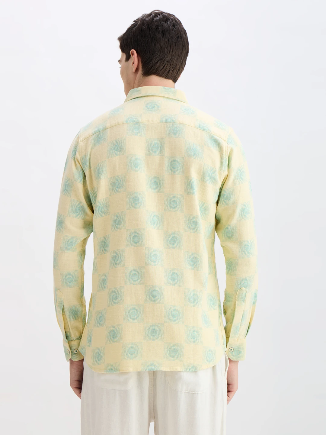 Back view of the shirt showing full check pattern and shoulder yoke
