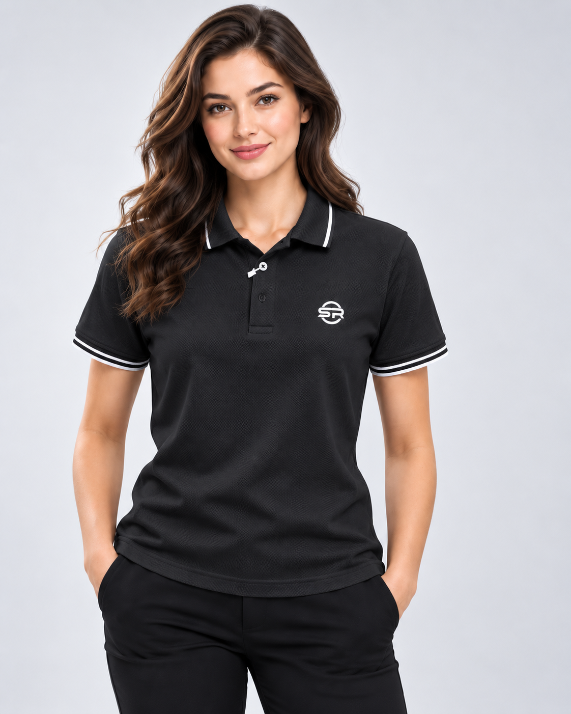Women's styling view of the black polo with contrast sleeve bands and chest logo