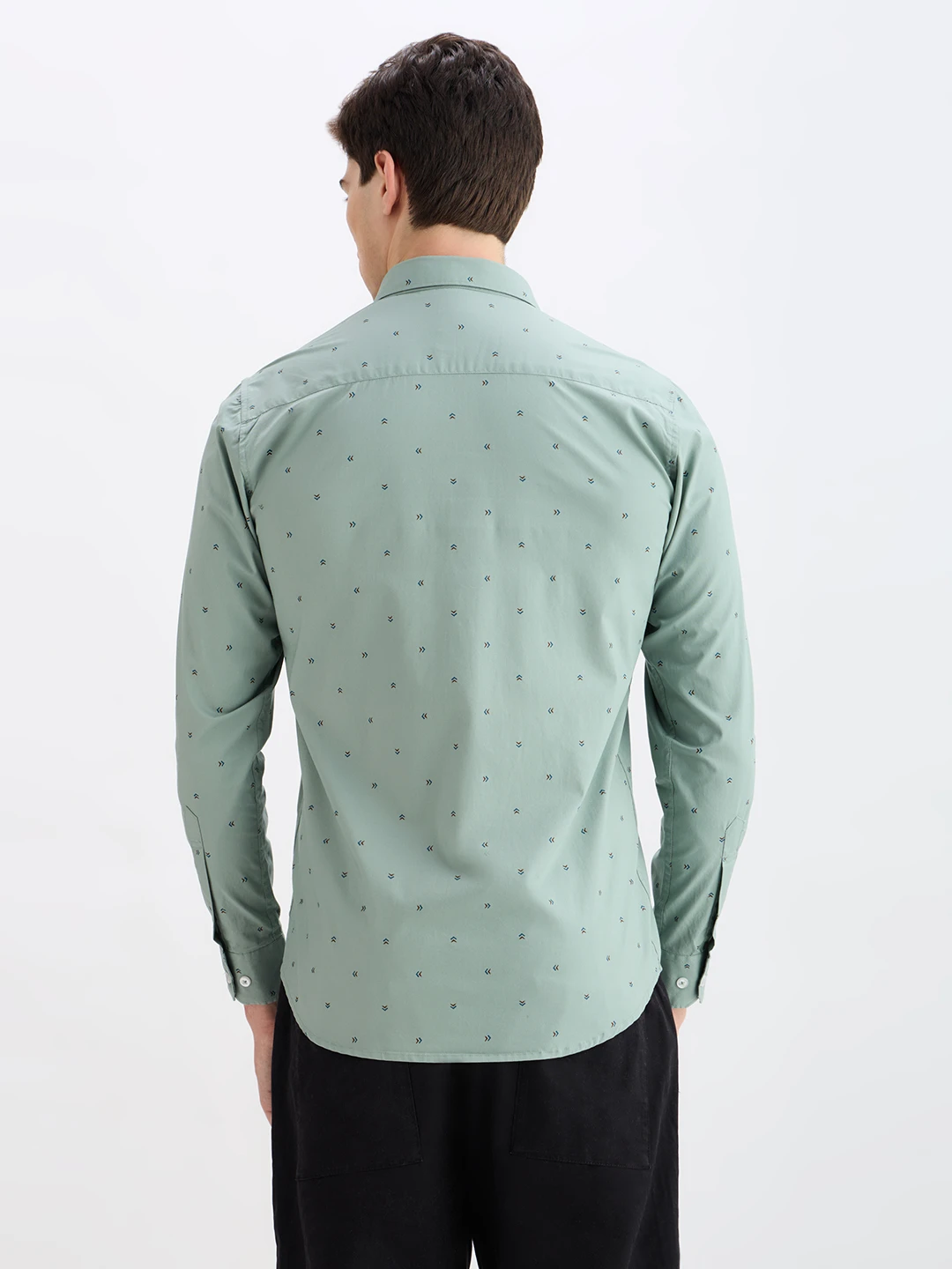 Back view of the sage green shirt with all-over small motif print
