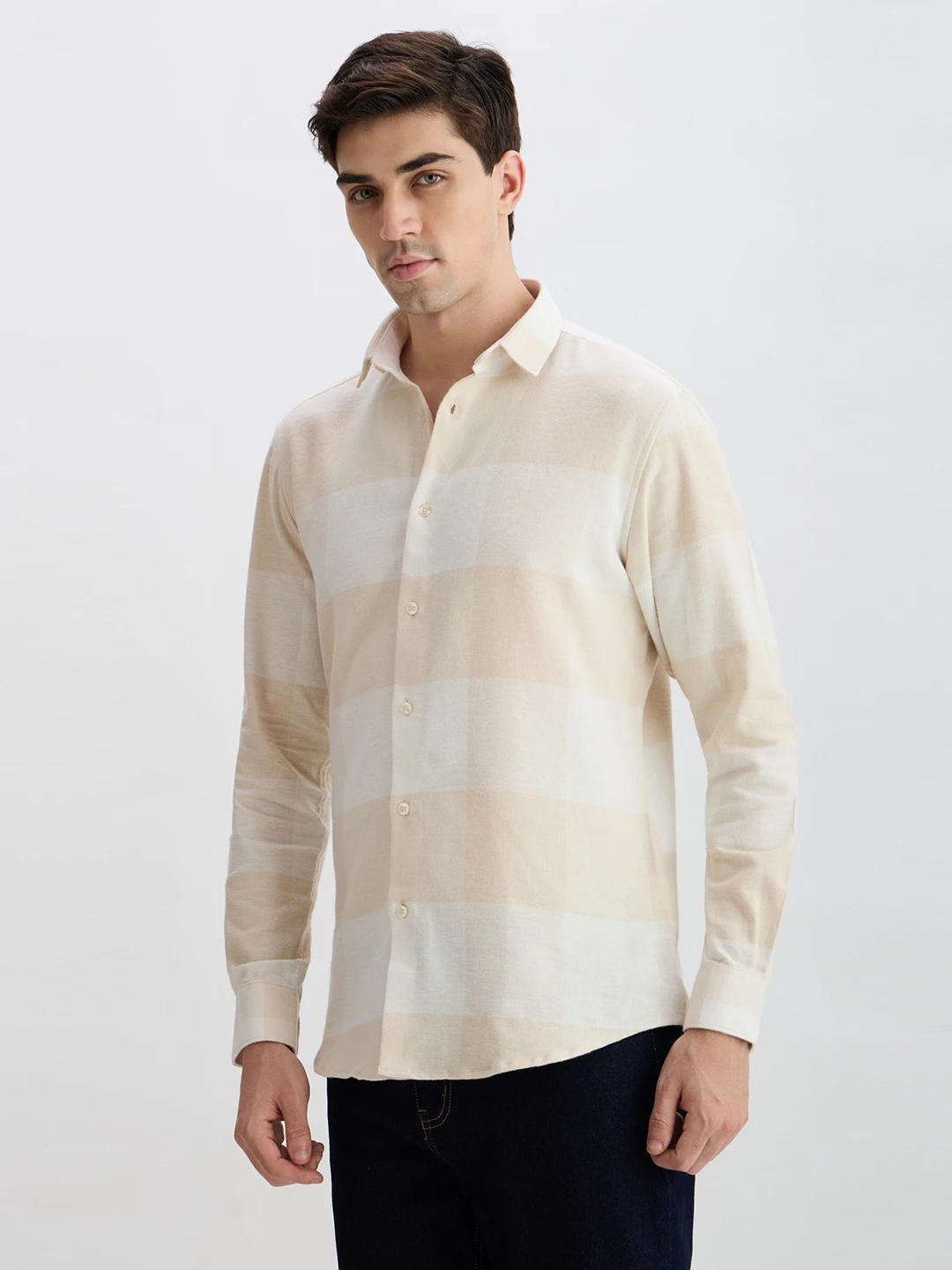 Three-quarter left view highlighting the soft cream checks and curved hemline