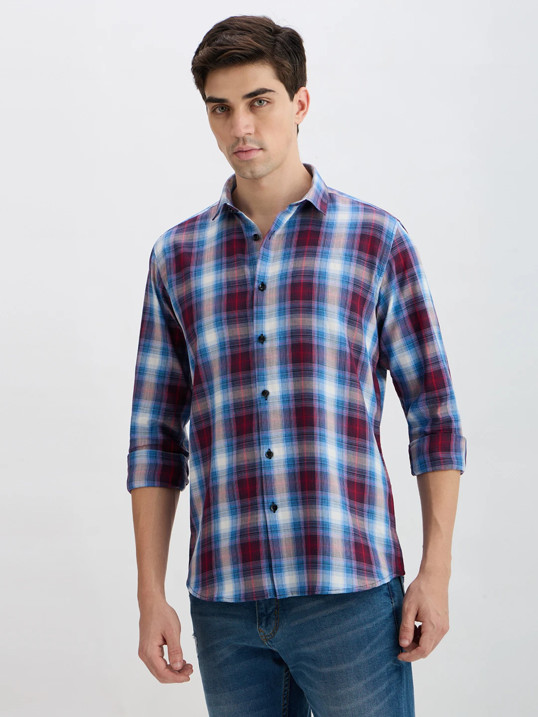 Slight angled front view showing the checked pattern and black button placket