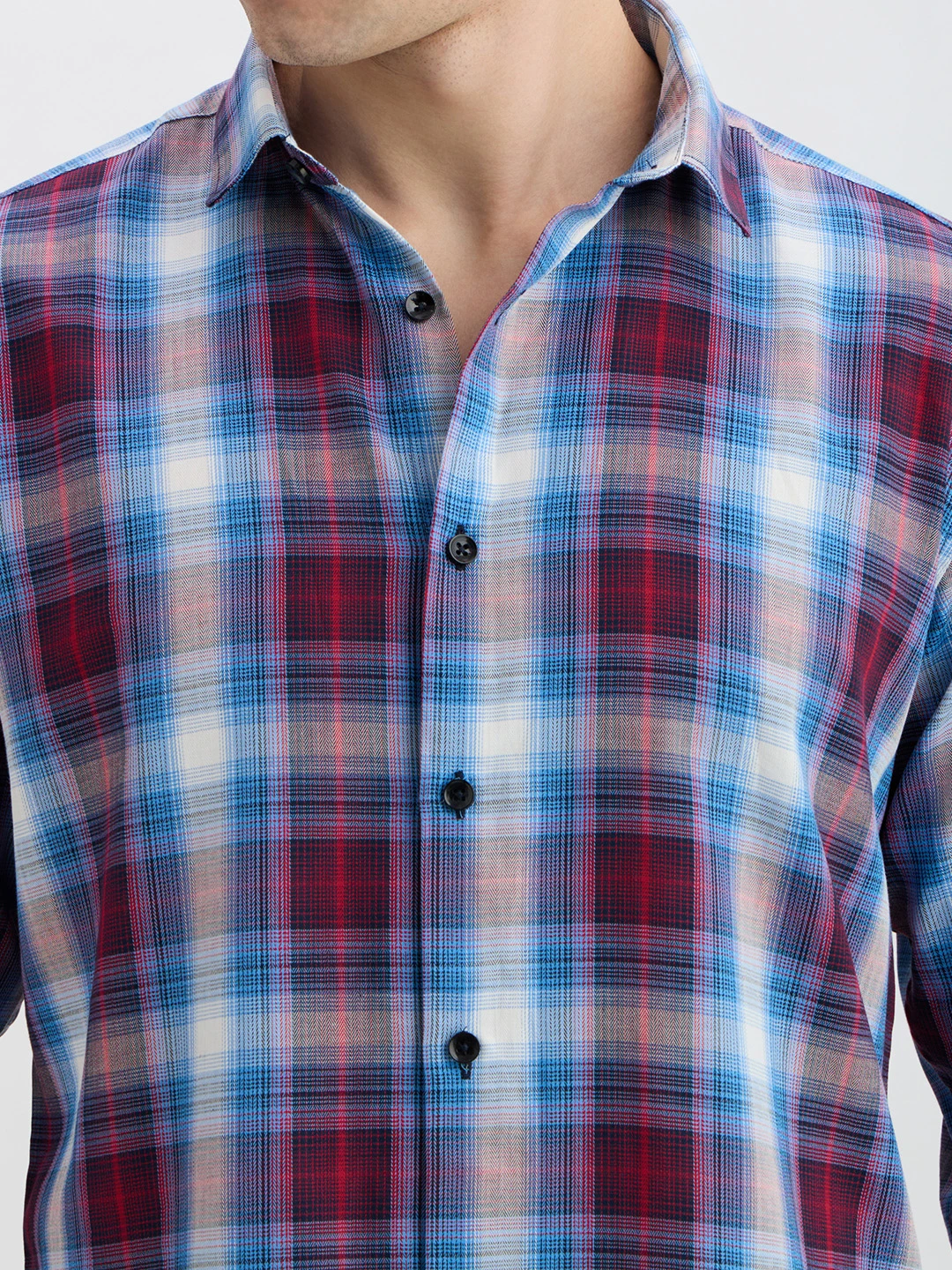 Close-up of collar, buttons and fine blue-maroon plaid fabric texture
