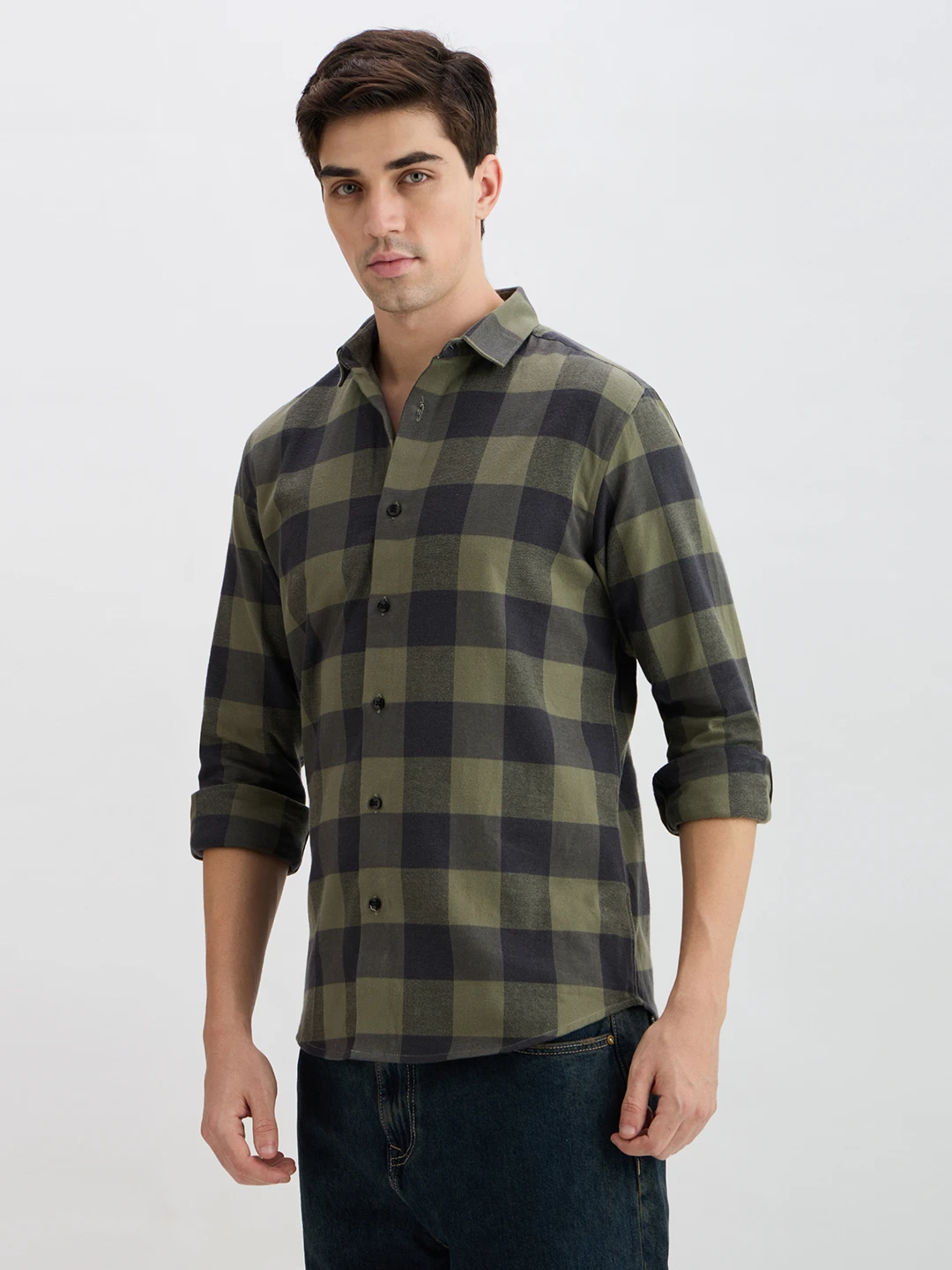 Three-quarter left view showing the large check pattern and curved hem of the casual shirt
