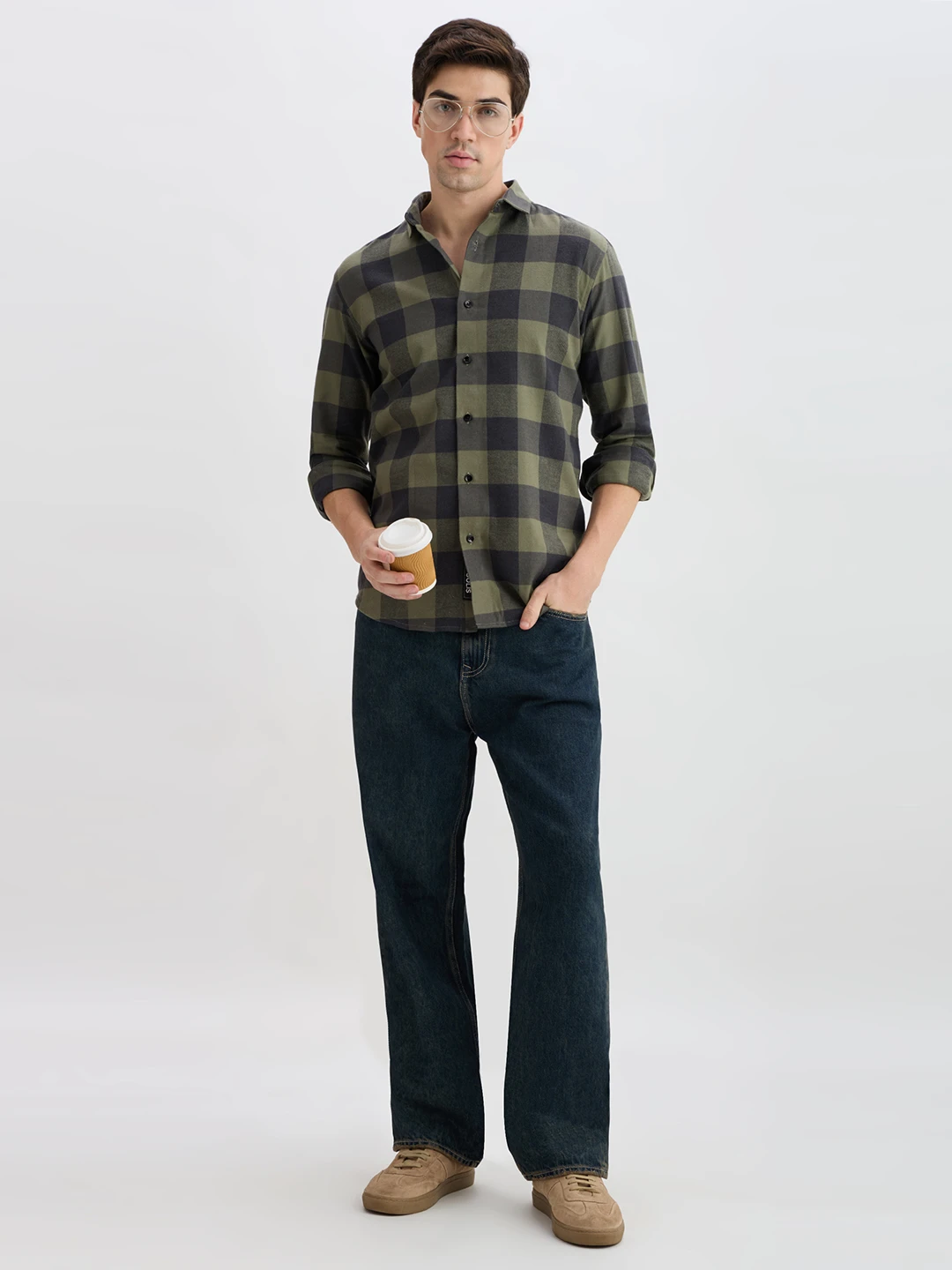 Full-length styled view of the checked shirt worn with jeans, glasses and a takeaway cup
