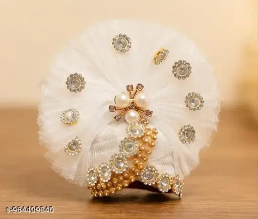 White pleated Laddu Gopal turban with pearl brooch center, gold bead trim, and scattered rhinestone studs