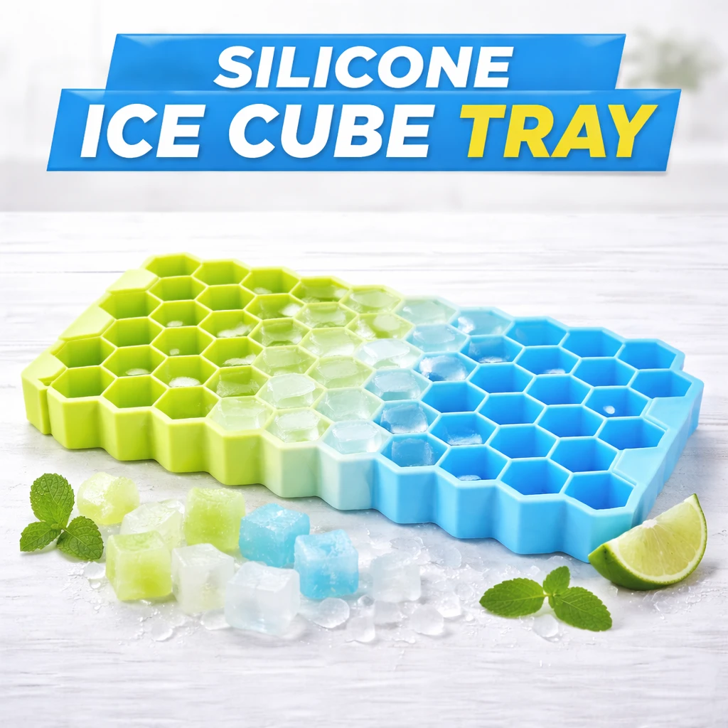 Blue and green hexagon silicone ice tray on a white surface with colored ice cubes, mint, and lime wedge