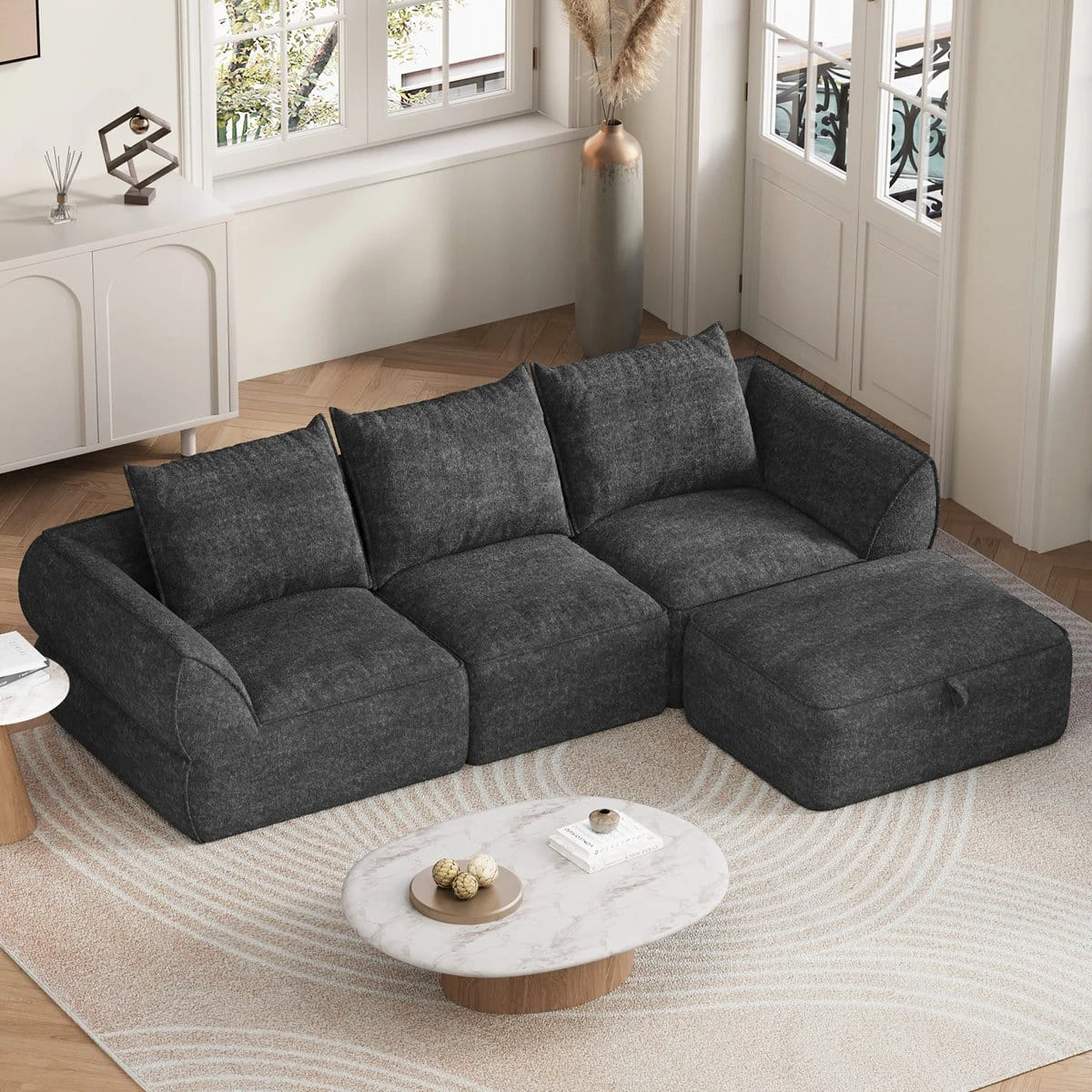 Angled top view showing the deep seats, three back cushions and movable ottoman section
