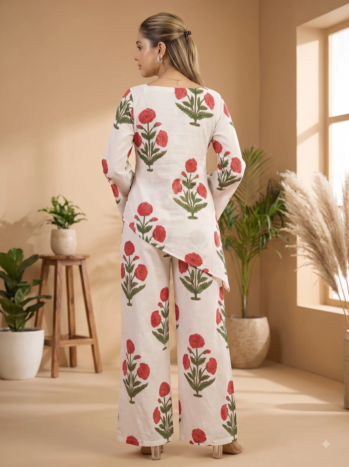 Back view of the white floral kurta set showing the rear print and asymmetric hemline