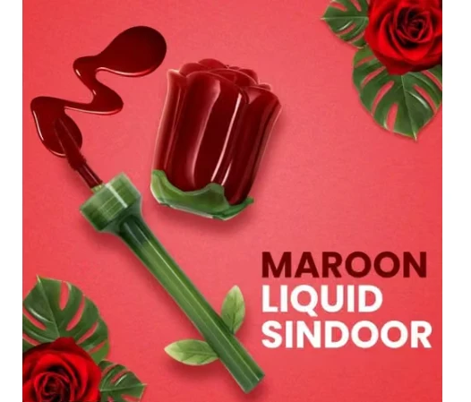 Opened rose-shaped maroon liquid sindoor with applicator wand and spilled pigment on pink background