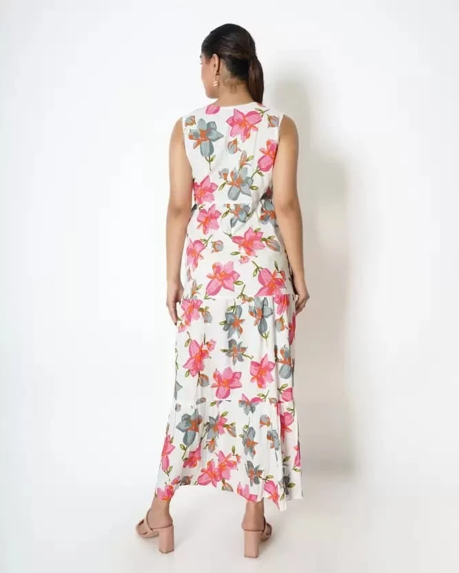 Back view of the white floral maxi dress showing sleeveless cut and flowing full-length silhouette