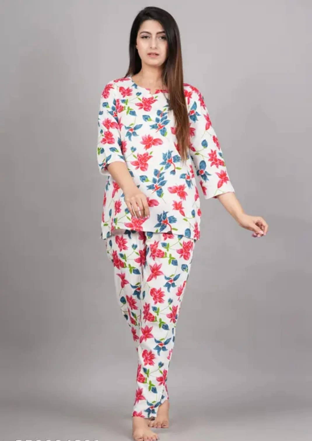 Front view of women's white lounge co-ord set with pink floral print and matching tapered pants