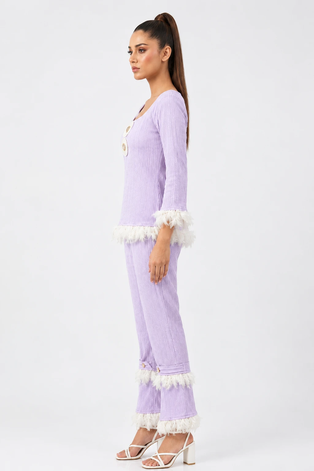Left side profile of the lavender ribbed two-piece set showing feather-trimmed sleeves and flared hems