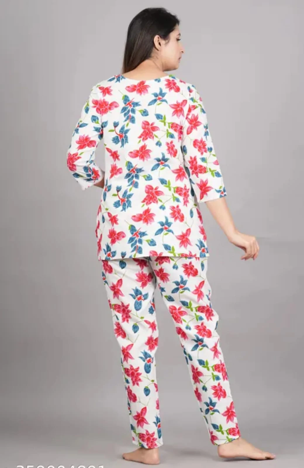 Front view of women's white lounge co-ord set with pink floral print and matching tapered pants