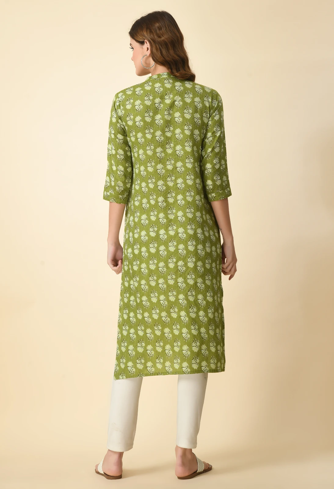 Back view of olive green printed kurta showing all-over motif and straight hem with 3/4 sleeves
