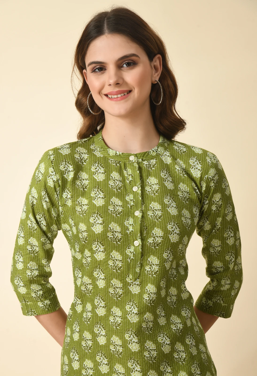 Waist-up view of olive green printed kurta with 3/4 sleeves and short button placket
