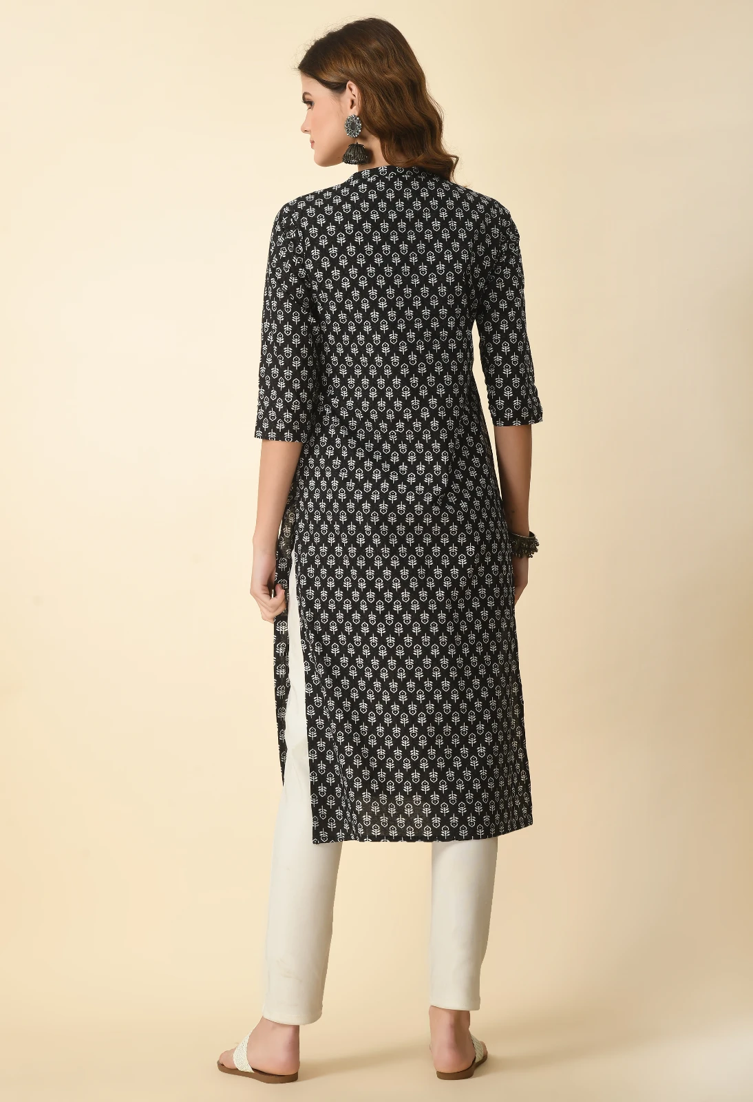 Back view of black printed straight kurta with three-quarter sleeves and calf-length hem