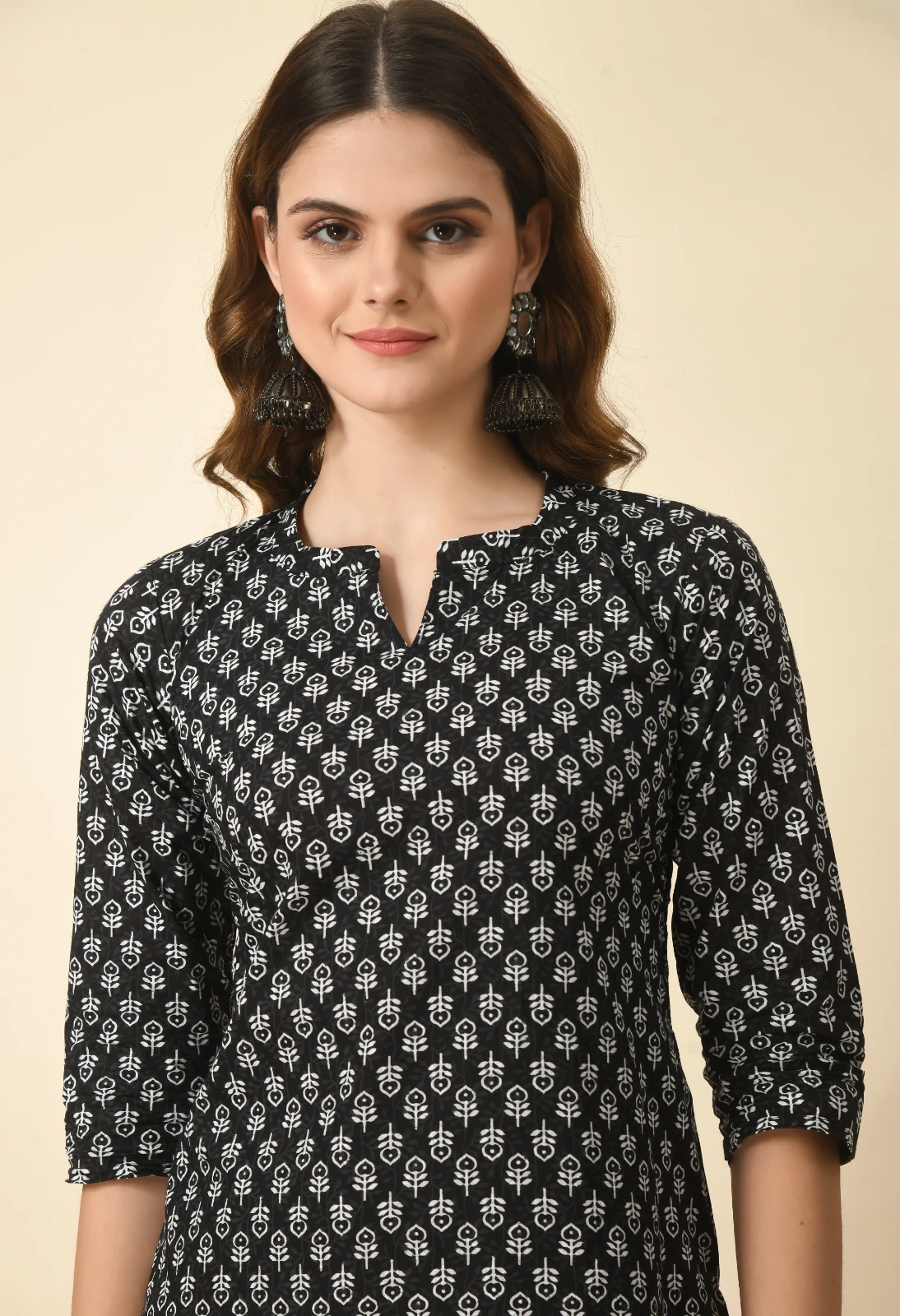 Mid-length front crop highlighting the notch neckline and white floral print on the black kurta