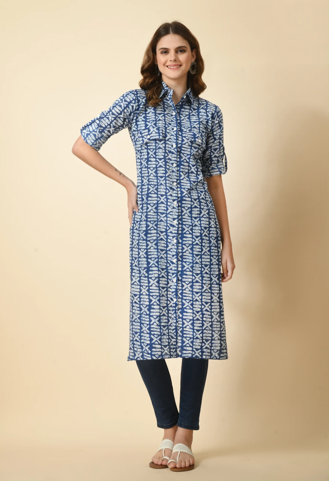 Full front view of blue and white printed kurta with flap pockets, white button placket, and rolled sleeves