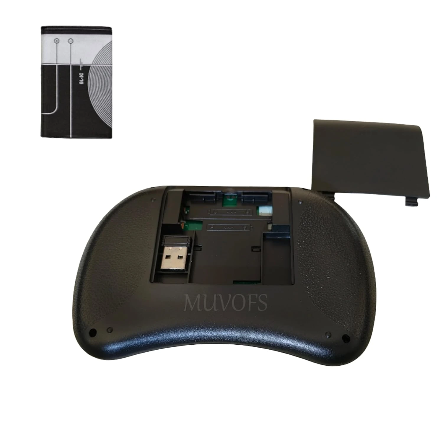 Back view of black mini keyboard with battery compartment open, USB receiver slot and removed cover beside it