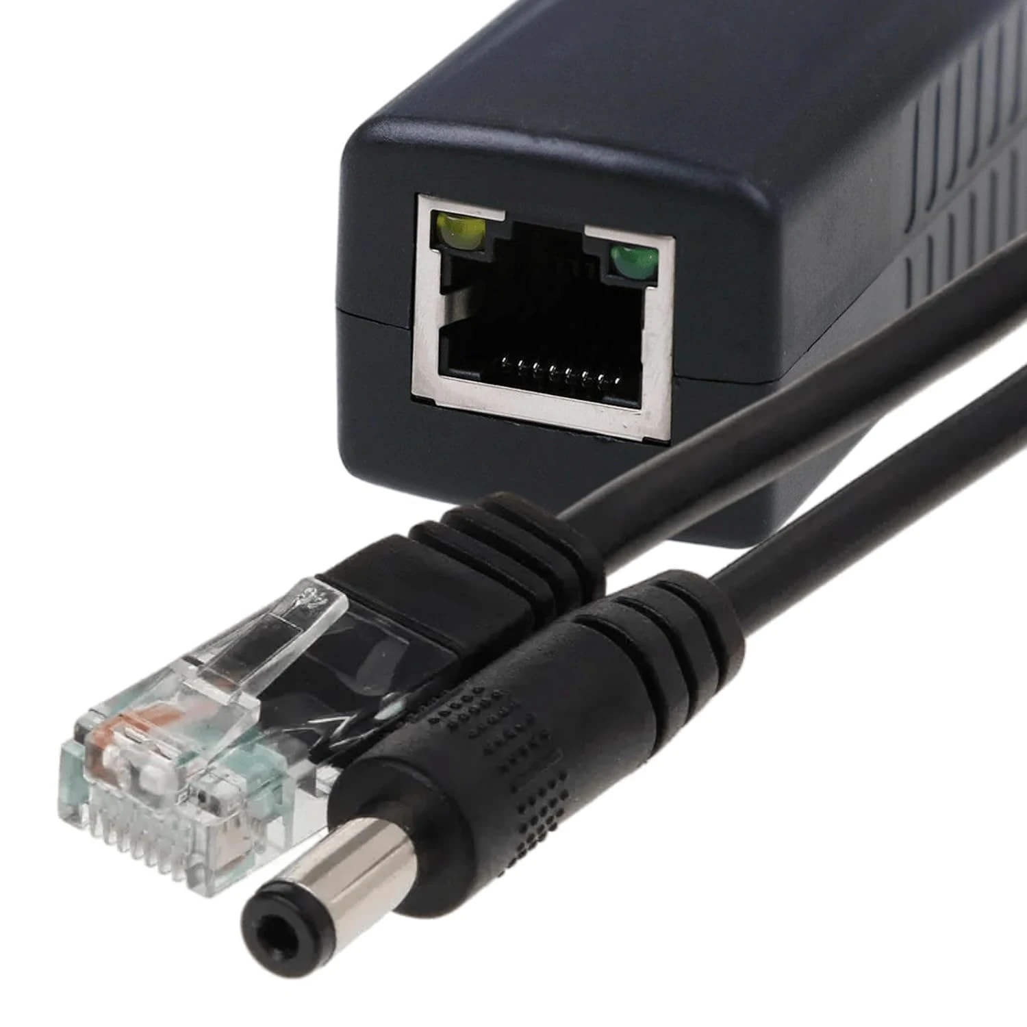Close-up of the RJ45 female port beside the transparent Ethernet plug and 12V barrel connector