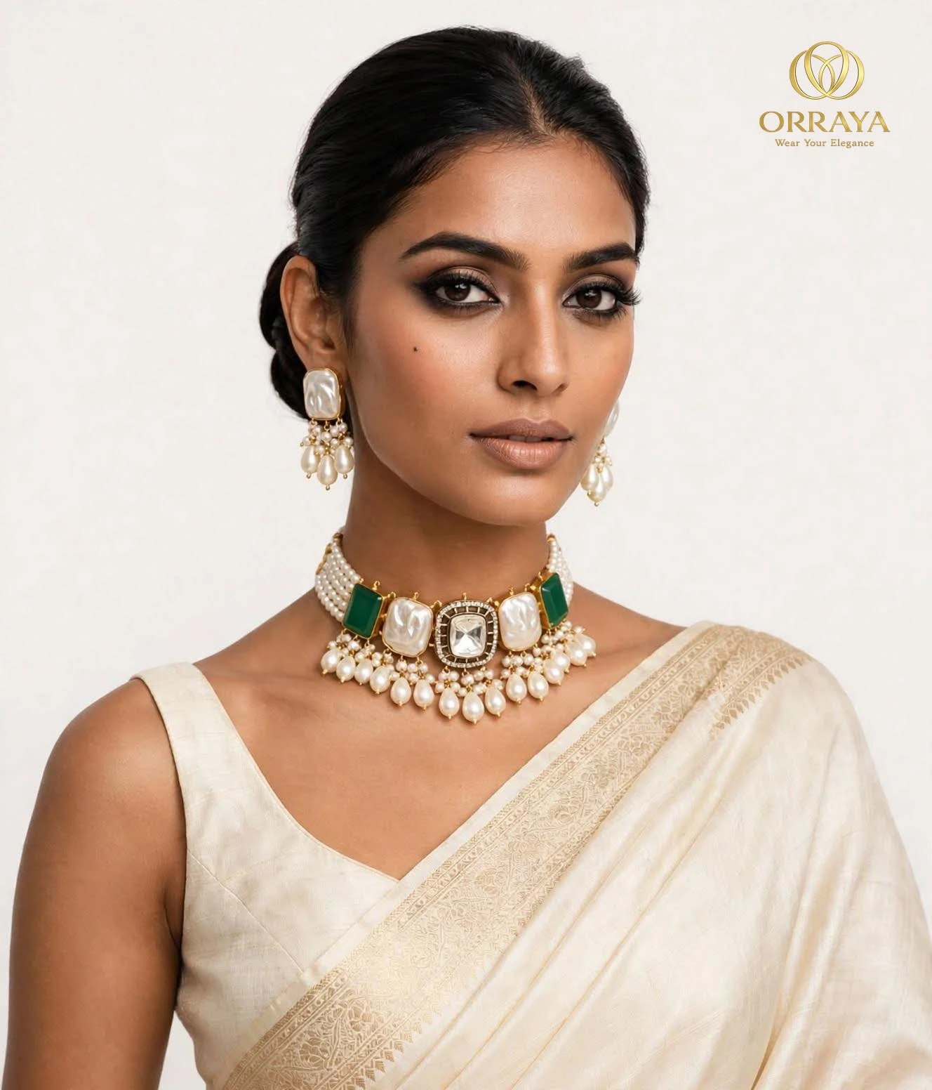 Front view of the choker worn close to the neck with pearl fringe and matching earrings against a plain backdrop
