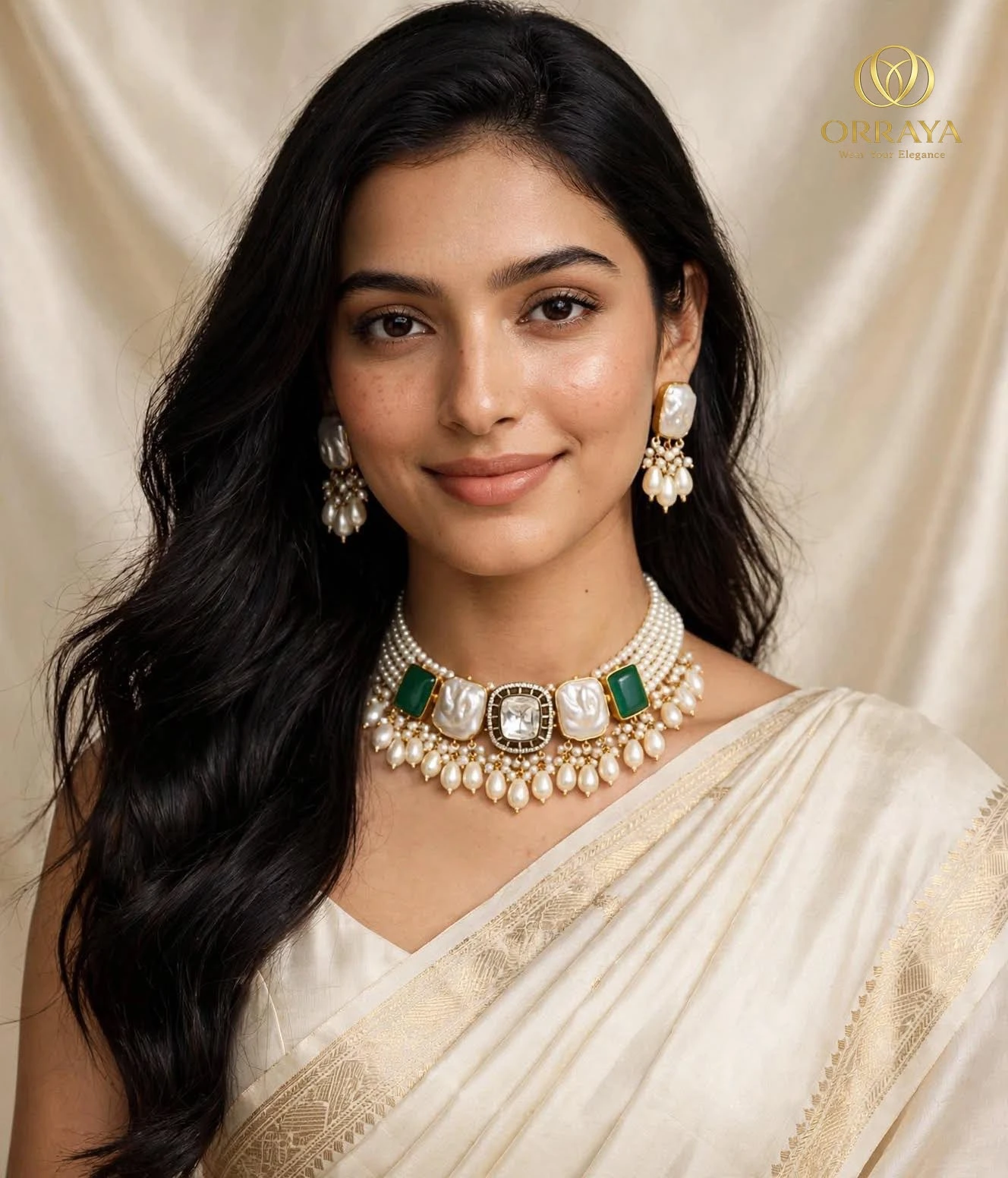Styled portrait highlighting the full choker set and both matching earrings with a cream saree