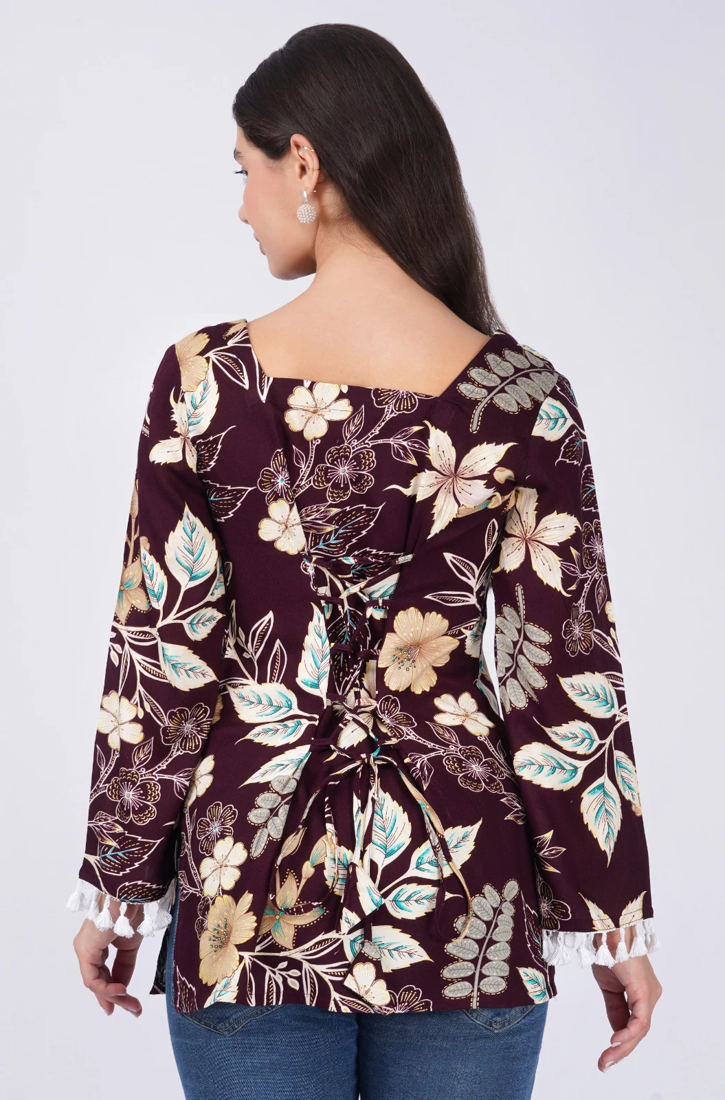 Back view showing square back neckline and corset-style tie detail on the burgundy floral top