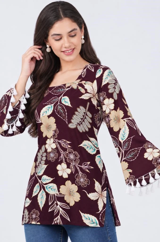 Three-quarter pose with side slit visible and raised sleeve showing white tassel trim in motion