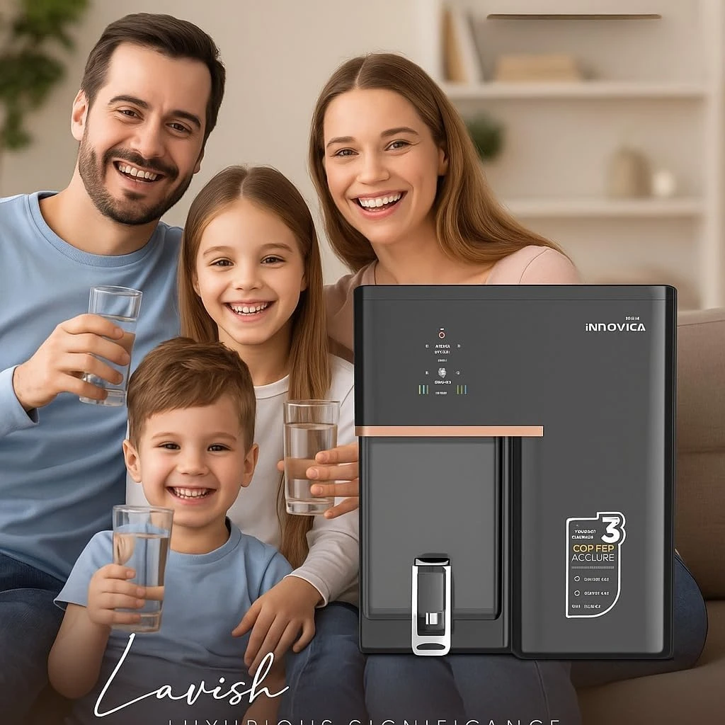 Lifestyle shot of the purifier beside a smiling family holding glasses of water indoors
