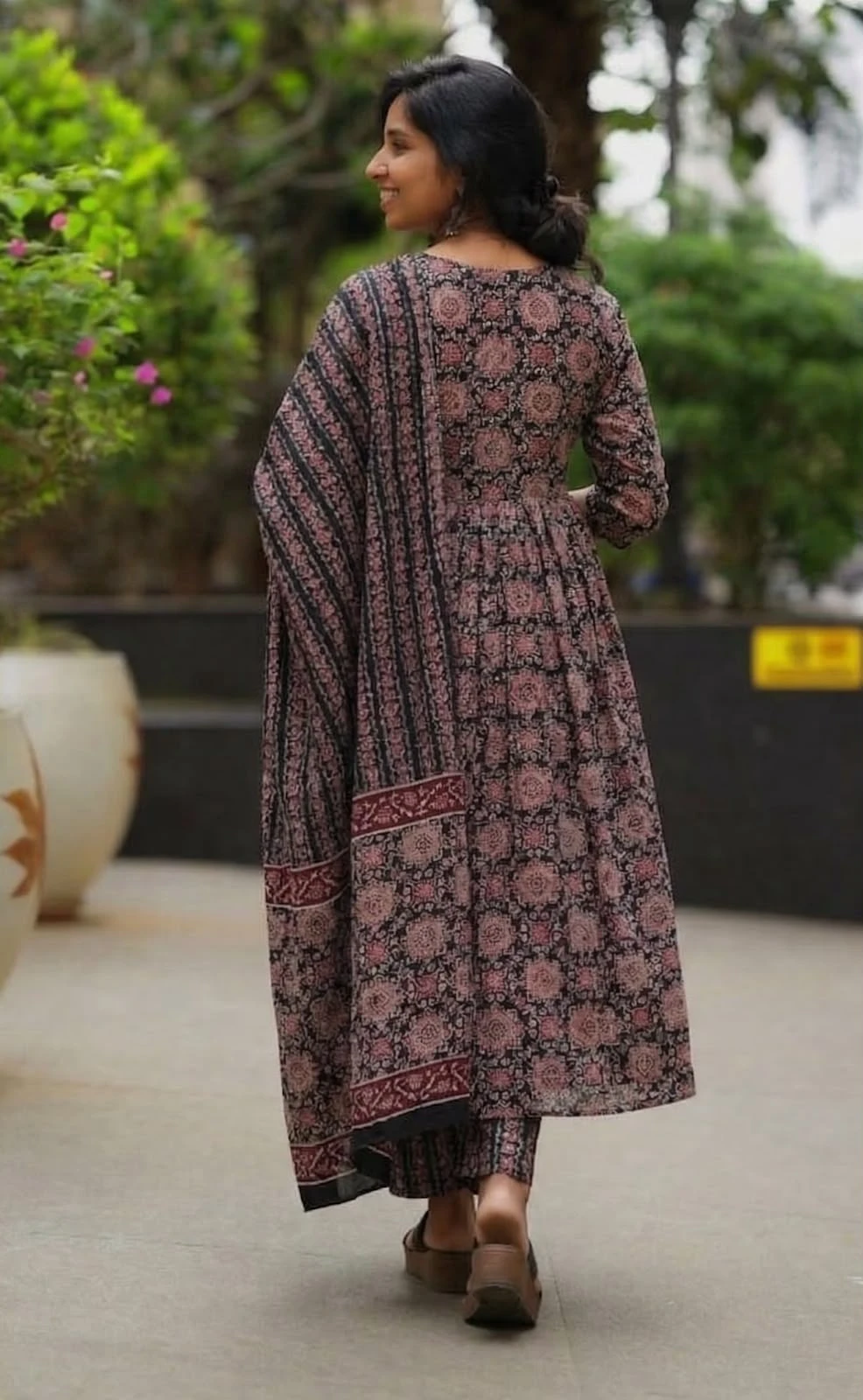 Back view showing all-over floral print and bordered dupatta on the matching ethnic set