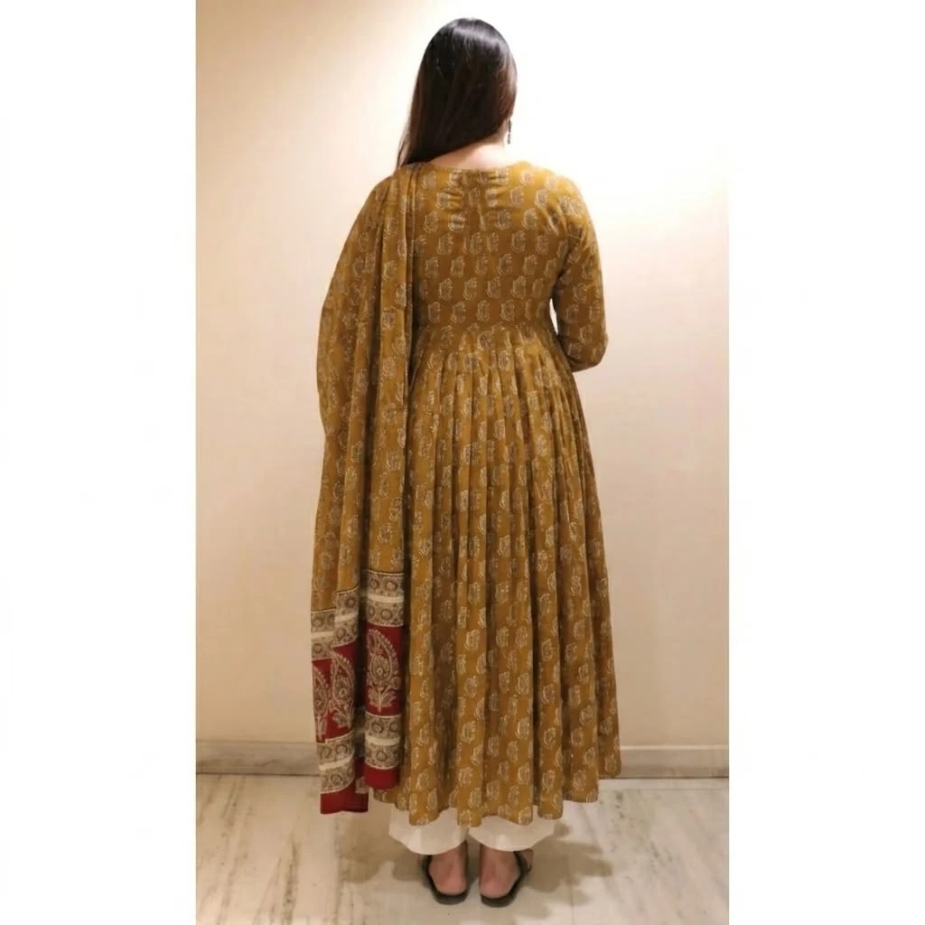 Back full-length view showing the flared silhouette and dupatta with contrast red border detail