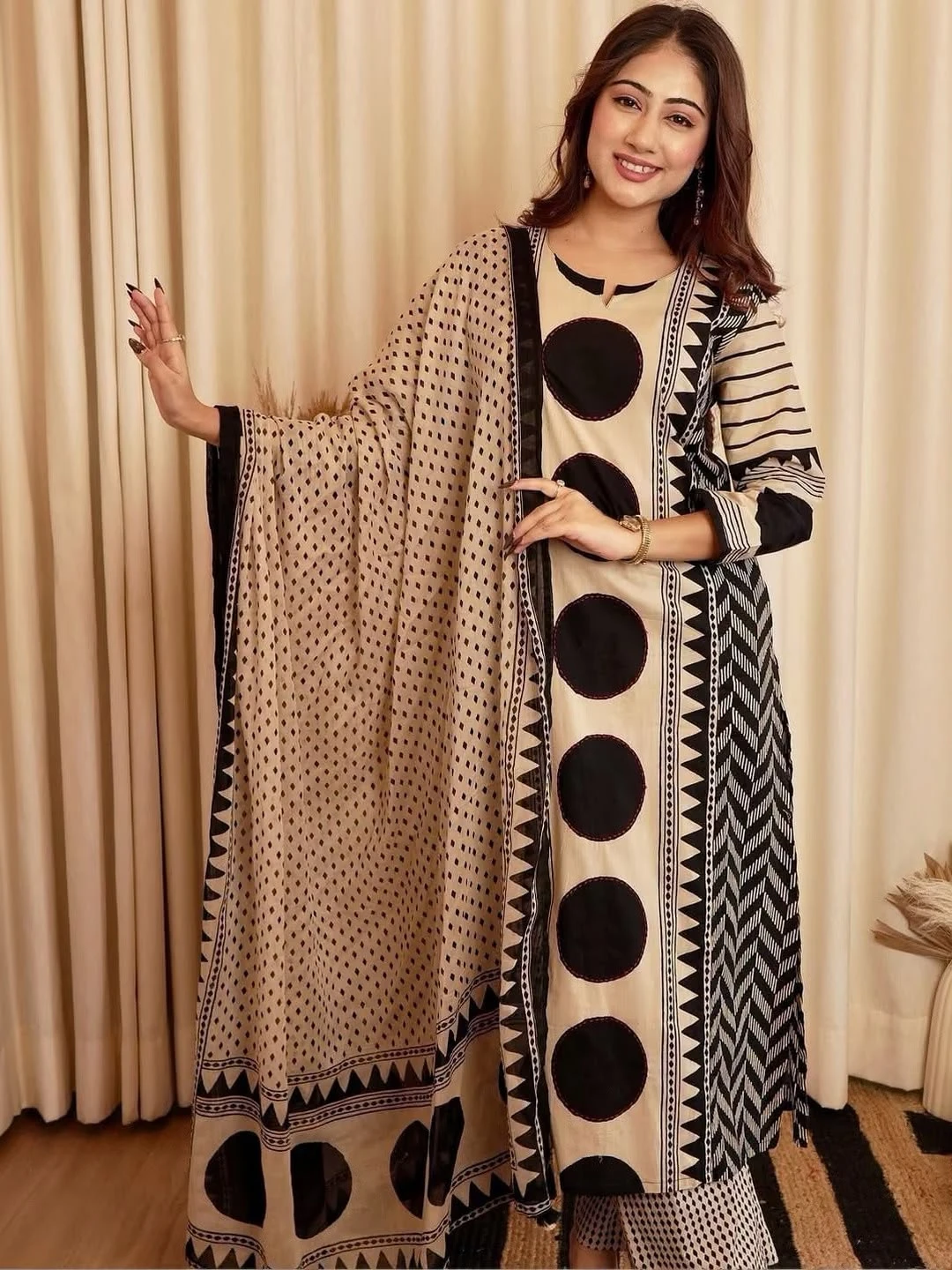Beige and black printed kurta set for women with a matching geometric print dupatta, featuring bold circular patterns and elegant ethnic wear styling by Vdcart.com.