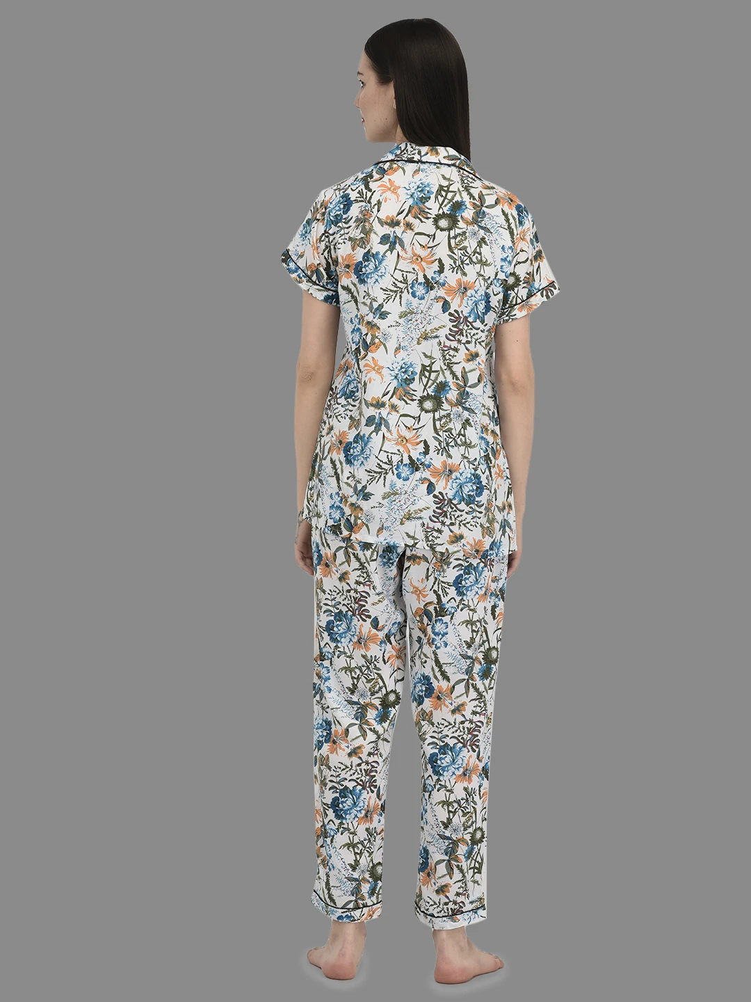 Back view showing all-over blue and peach floral print on the collared top and matching lounge pants