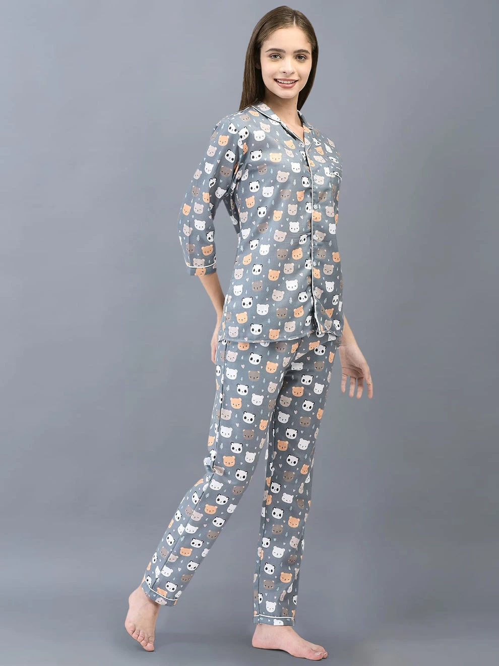 Three-quarter front pose highlighting the soft grey color, bear motif and matching pajama bottoms