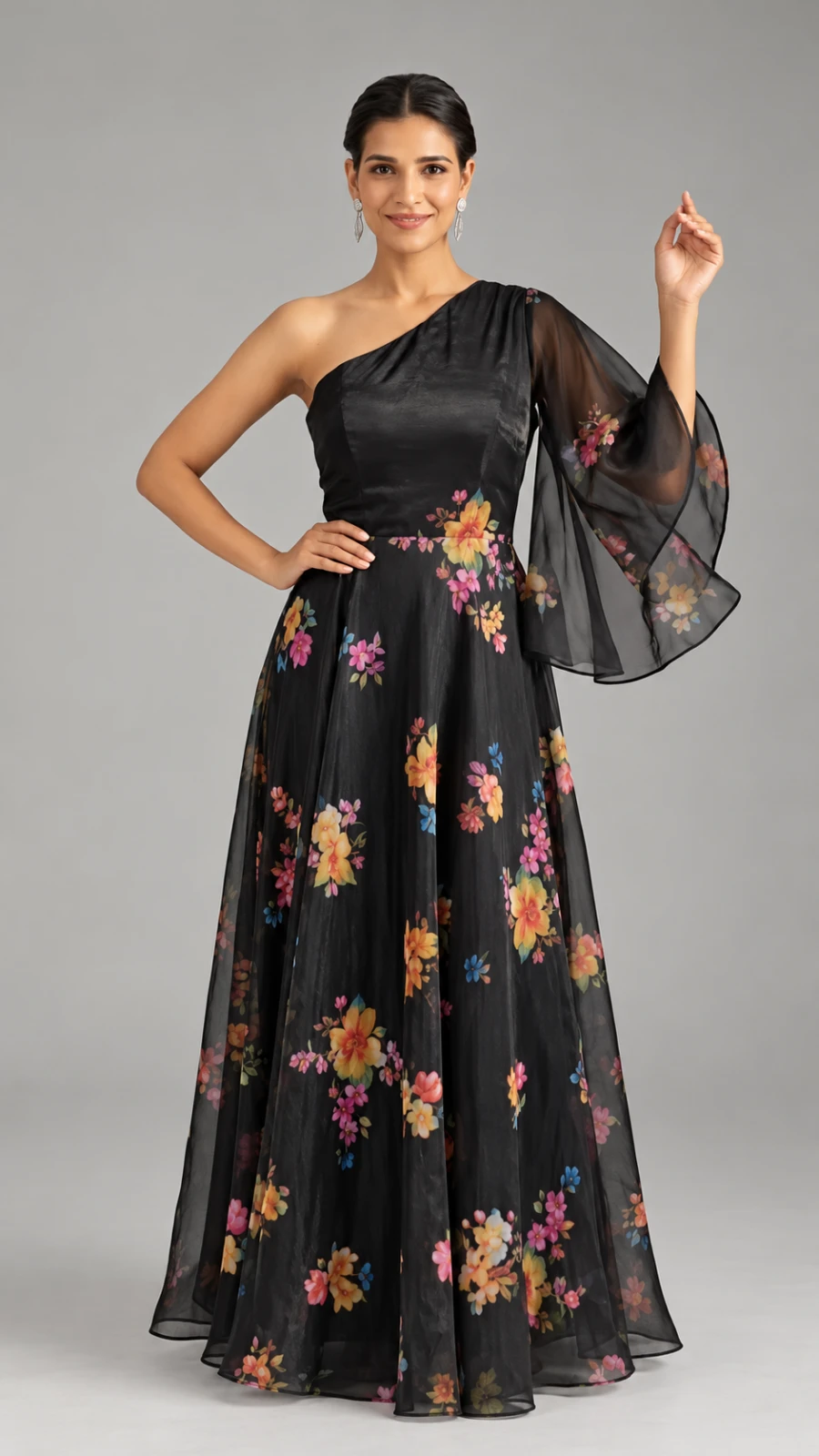 Front view of black one-shoulder maxi dress with colorful floral print and sheer bell sleeve
