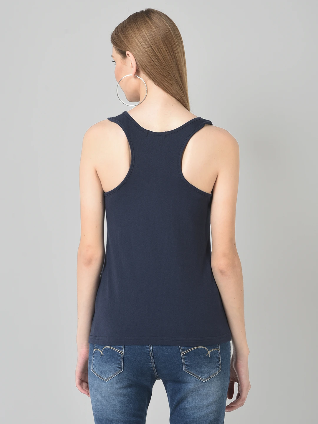 Back view showing racerback design of the navy blue tank top