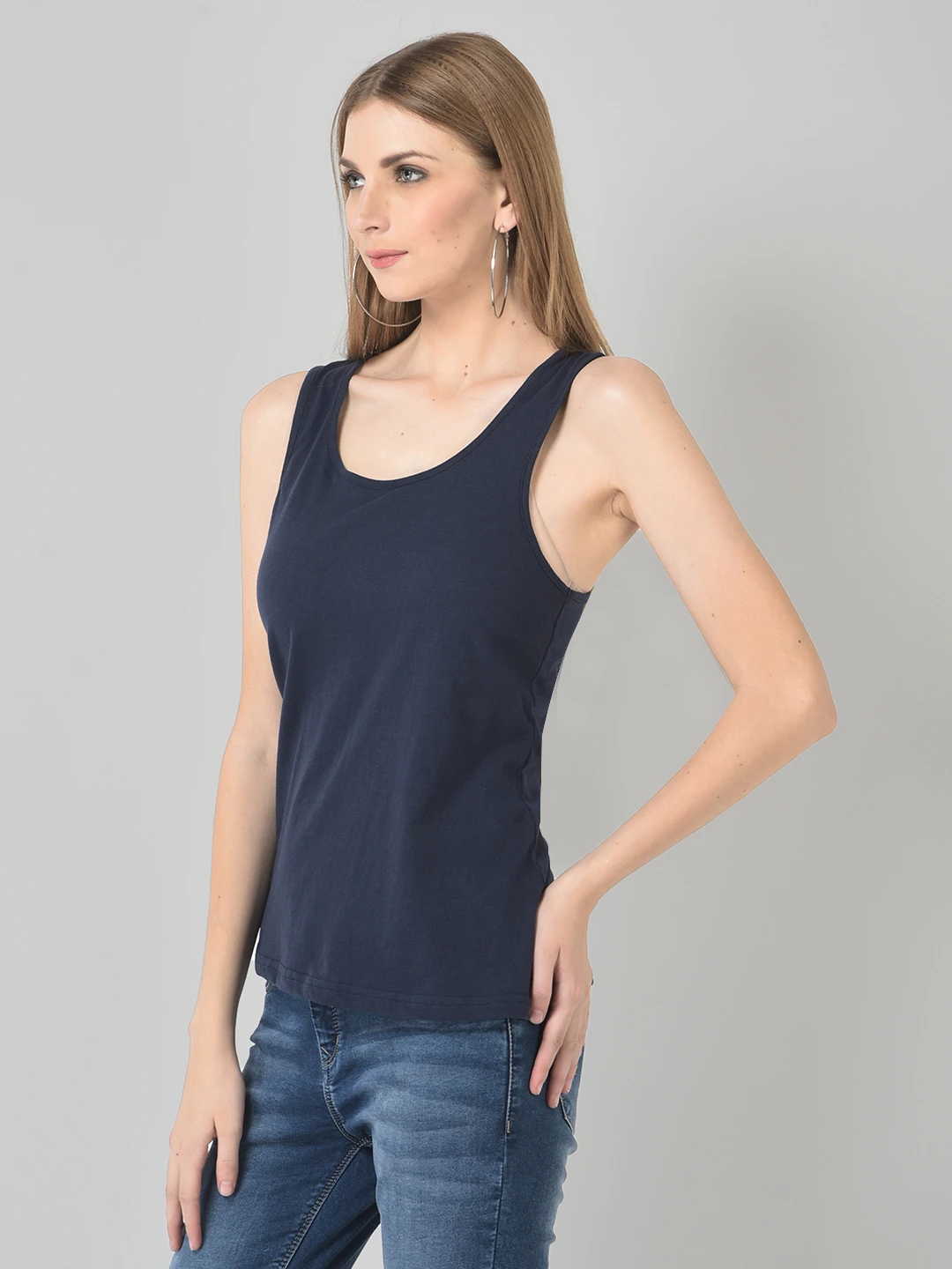 Angled side-front view highlighting the scoop neckline and relaxed fit