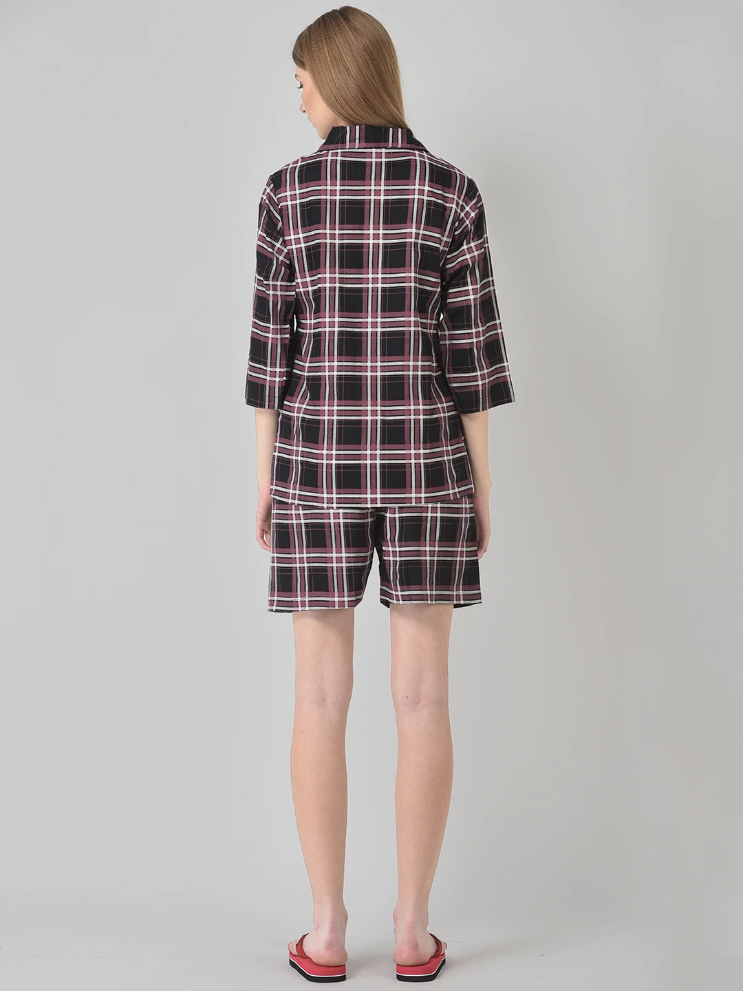 Rear full-body view of maroon plaid sleep set with three-quarter sleeves and knee-length shorts on a model