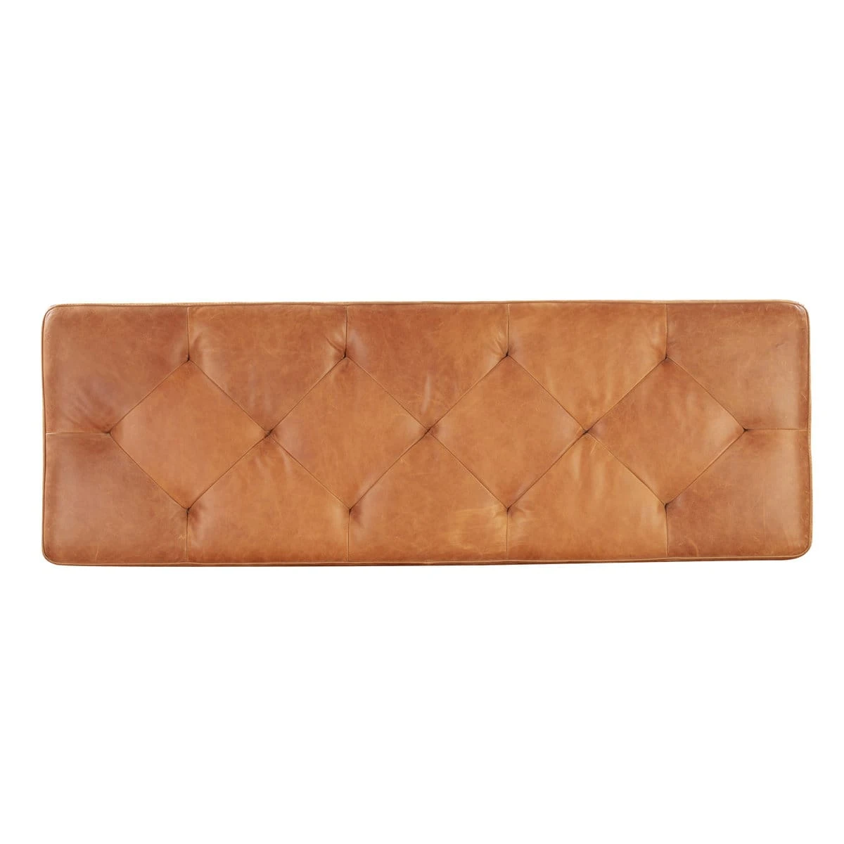 Top-down view of the diamond-tufted full grain leather lid in cognac tan