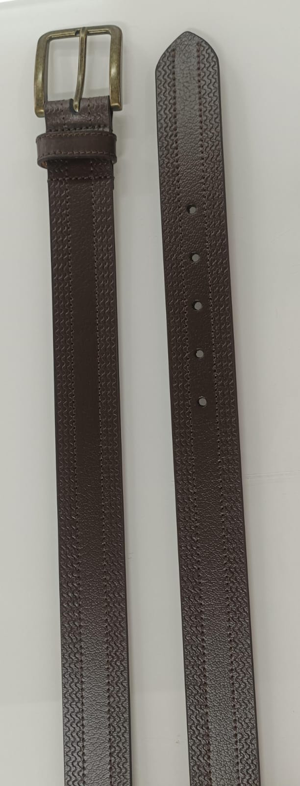 Brown belt coiled flat with smooth strap, keeper loop and shiny gold-tone pin buckle on white background