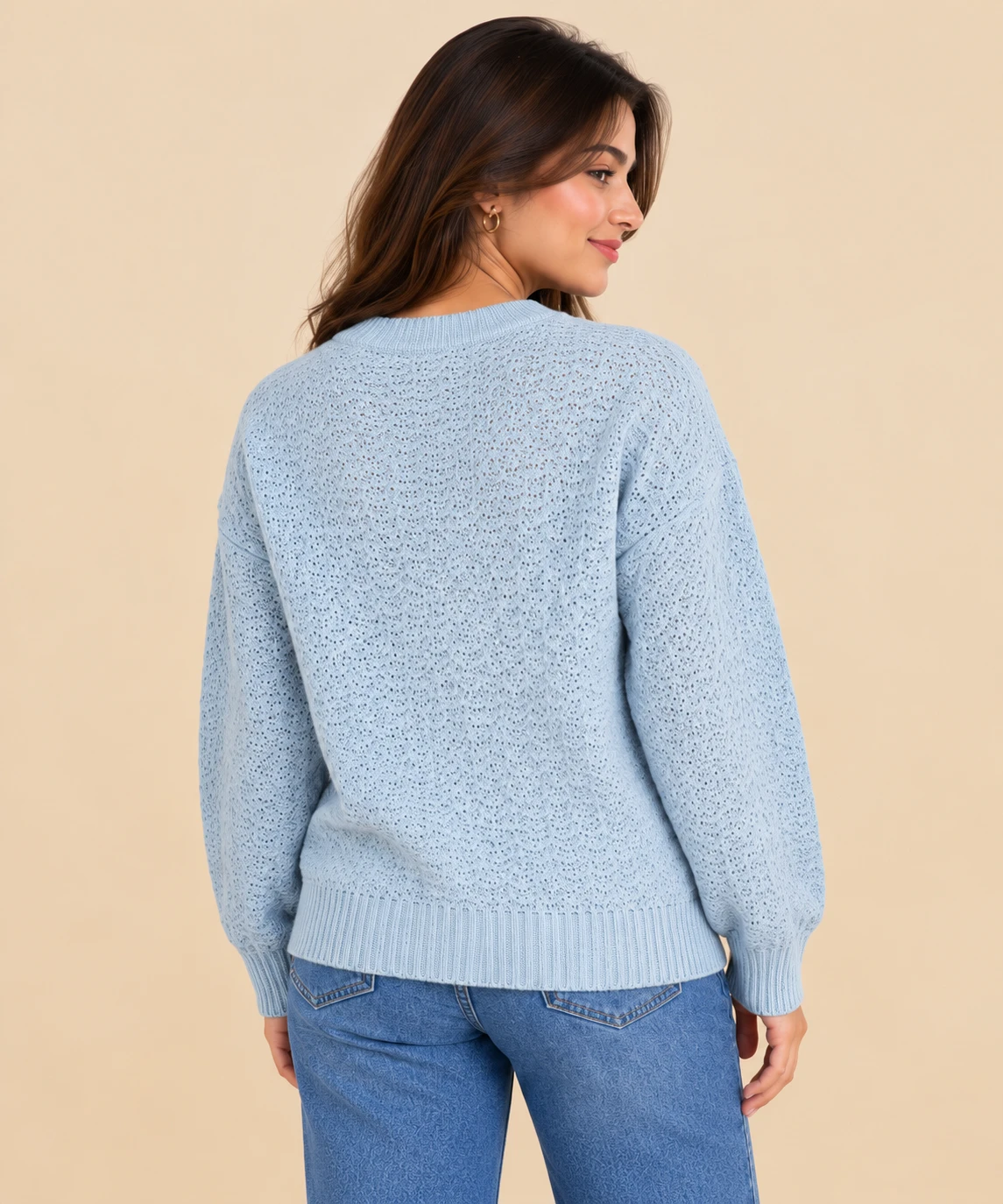 Collage showing front, back and close-up views of a light blue textured knit crew neck sweater
